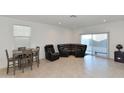 Living room with sectional sofa and small dining area at 3372 W Stanton Ave, Apache Junction, AZ 85120