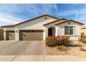 Single-story home with two-car garage and landscaped front yard at 3908 S 78Th Ln, Phoenix, AZ 85043