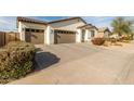 Single-story home with two-car garage and landscaped front yard at 3908 S 78Th Ln, Phoenix, AZ 85043