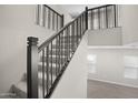 Modern metal staircase with carpeted steps at 4923 E Village Dr, Scottsdale, AZ 85254