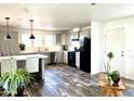 Modern kitchen with gray cabinets, island, and stainless steel appliances at 701 S Dobson Rd # 158, Mesa, AZ 85202