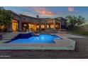 Expansive backyard oasis with a sparkling pool, spa, and spacious patio at 9325 E Paraiso Dr, Scottsdale, AZ 85255