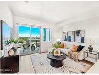 Bright living room with modern furniture and balcony access at 3131 N Central Ave # 3019, Phoenix, AZ 85012