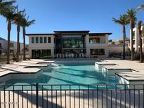 Resort-style pool with large deck and nearby clubhouse at 6587 N Palmeraie Blvd # 3031, Paradise Valley, AZ 85253