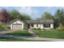 Craftsman style home exterior with two car garage and landscaped yard at 3942 E Penedes Dr, Gilbert, AZ 85298