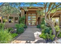 Elegant entryway with stone accents and double doors at 10040 E Happy Valley Rd # 1, Scottsdale, AZ 85255