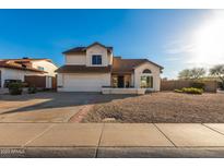 Two-story house with a double garage and landscaped yard at 7233 W Corrine Dr, Peoria, AZ 85381