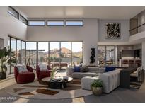 Spacious living room with large windows, mountain views, and modern furniture at 5815 N Palo Cristi Rd, Paradise Valley, AZ 85253