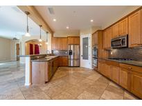Gourmet kitchen featuring wood cabinets and granite counters at 21521 S 215Th Pl, Queen Creek, AZ 85142