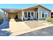 Mobile home with carport and seating area at 650 N Hawes Rd # 4829, Mesa, AZ 85207