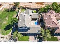 Aerial view of a large house with a pool and putting green at 1327 E Judi Dr, Casa Grande, AZ 85122