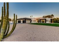 Modern house exterior with a desert landscape at 12140 N 106Th St, Scottsdale, AZ 85259