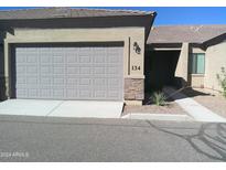 Attached garage with a large door and ample space for parking and storage at 846 N Pueblo Dr # 134, Casa Grande, AZ 85122