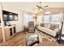 Bright living room with hardwood floors and comfy seating at 377 S Gypsum Dr, Apache Junction, AZ 85119