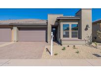 Modern home exterior with two-car garage at 374 E Citrus Hollow Way, Queen Creek, AZ 85140