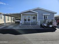 Single-story home with carport and golf cart at 650 N Hawes Rd # 3423, Mesa, AZ 85207
