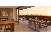 Living room with access to a large balcony with mountain views at 4849 N Camelback Ridge Rd # A306, Scottsdale, AZ 85251