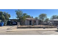 Small house with front yard and carport at 121 N 28Th Ave, Phoenix, AZ 85009