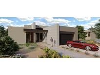 Contemporary home exterior with landscaped yard and attached garage at 10977 E Oberlin Way, Scottsdale, AZ 85262