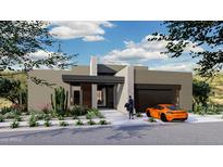Modern home exterior with desert landscaping and two-car garage at 10905 E Oberlin Way, Scottsdale, AZ 85262