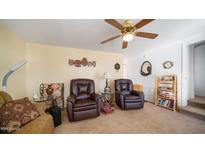 Cozy living room featuring two recliner chairs and a bookshelf at 728 Emerald Dr # 728, Apache Junction, AZ 85119