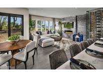 Spacious great room with fireplace, wine cellar, and golf course views at 37200 N Cave Creek Road Rd # 1125, Scottsdale, AZ 85262