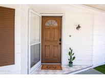 Inviting front door entrance with a welcoming mat at 16410 N 32Nd Pl, Phoenix, AZ 85032