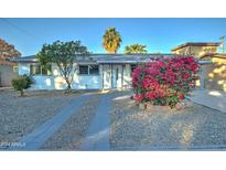 Charming single-story home with a well-manicured front yard and updated facade at 4522 N 14Th Ave, Phoenix, AZ 85013