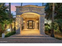 Ornate front entry with elaborate stonework at 6412 E Doubletree Ranch Rd, Paradise Valley, AZ 85253