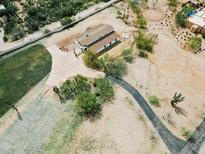 Aerial view of a ranch-style house with extensive grounds at 29429 N 64Th St, Cave Creek, AZ 85331