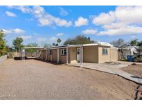 Tan single story home with carport and front yard at 225 N 89Th St, Mesa, AZ 85207