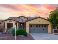 One-story home with stone accents and a two-car garage at 28436 N 123Rd Ln, Peoria, AZ 85383