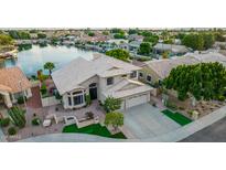 Waterfront home with a large backyard and basketball court at 5477 W Quail Ave, Glendale, AZ 85308