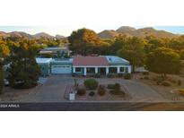 Stunning aerial view of a home nestled in a scenic mountain setting at 4601 E Desert Cove Ave, Phoenix, AZ 85028