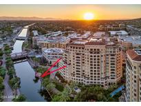 Highrise building near canal with city views at sunset at 7175 E Camelback Rd # 704, Scottsdale, AZ 85251