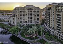 Luxury highrise building with water views at sunset at 7175 E Camelback Rd # 704, Scottsdale, AZ 85251