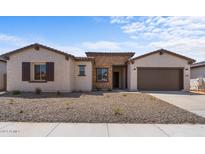 New single story home with a two-car garage and stone accents at 37607 W Padilla St, Maricopa, AZ 85138