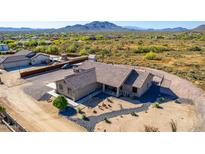 Aerial view of a sprawling ranch house with desert landscaping at 39730 N New River Rd, Phoenix, AZ 85086