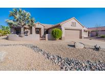 Single story home with desert landscaping and two-car garage at 20419 N Shadow Mountain Dr, Surprise, AZ 85374
