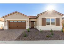 One-story home with brown garage door and desert landscaping at 16399 W Avenida Del Sol --, Surprise, AZ 85387