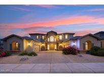 Two story home with landscaping at dusk at 3852 E Expedition Way, Phoenix, AZ 85050