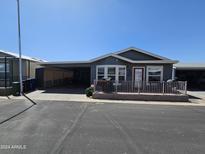 Gray house with a covered patio and a red door at 650 N Hawes Rd # 4507, Mesa, AZ 85207