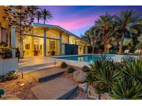 Stunning pool and patio area with mountain views at sunset at 8517 N 48Th Pl, Paradise Valley, AZ 85253