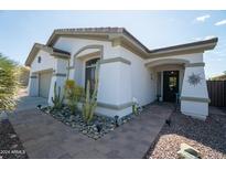 Charming single-story home with welcoming front entry and xeriscaping at 41417 N Clear Crossing Rd, Anthem, AZ 85086