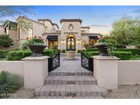Grand estate with a courtyard and gated entrance at 9926 E Kemper Way, Scottsdale, AZ 85255