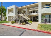 Condo building exterior with stairs and landscaping at 3002 N 70Th St # 239, Scottsdale, AZ 85251