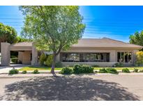 Ranch style home with large windows and mature landscaping at 1920 E Schooner Ct, Gilbert, AZ 85234