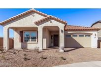 Charming one-story home with a terracotta roof and landscaped yard at 21816 E Saddle E Ct, Queen Creek, AZ 85142