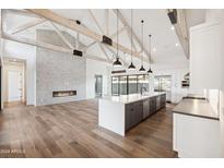 Spacious kitchen with island, stainless steel appliances, and white cabinetry at 8509 S 10Th Ln # 23, Phoenix, AZ 85041