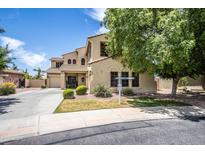 Two-story house with landscaping and driveway, offering curb appeal at 16612 N 151St Ln, Surprise, AZ 85374